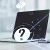 question marks and laptop
