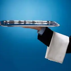 A waiter holding a tray